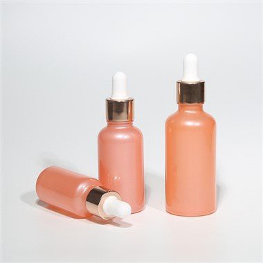 Rozā stikla pilinātāja pudeles